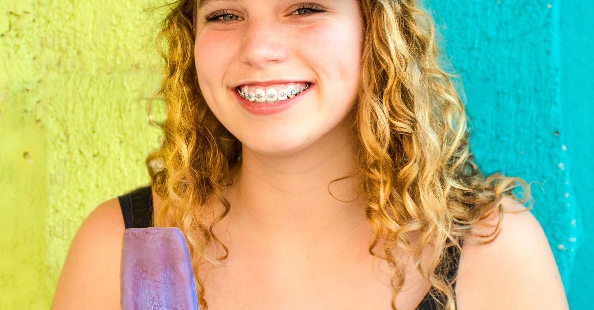 Happy young woman enjoying a cold treat, pure joy