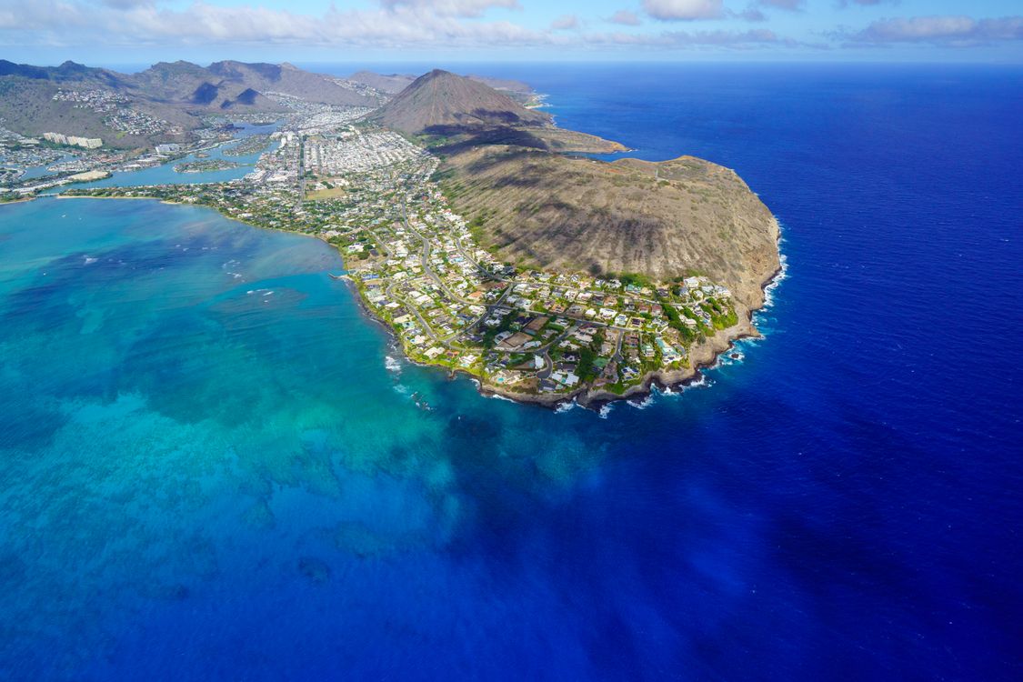Aerial view of Oahu's coastline with vibrant blue water